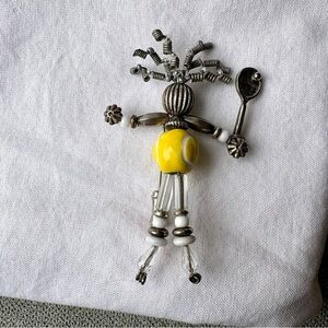 Silver and yellow tennis pin
